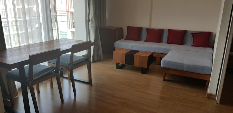 furnished living room - one bedroom condo rent at the nimmana